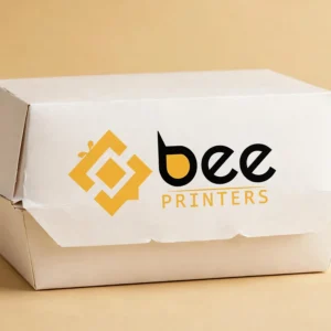Custom shrimp box in warm white, a seafood takeaway carton with the Bee Printers logo printed on it, single hero box on a warm golden-beige studio backdrop