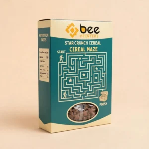 Teal and cream Star Crunch cereal box with the Bee Printers logo at the top, a large START to FINISH maze game on the front, a nutrition facts side panel and an oval window showing star-shaped cereal on a beige background, showing cereal box maze