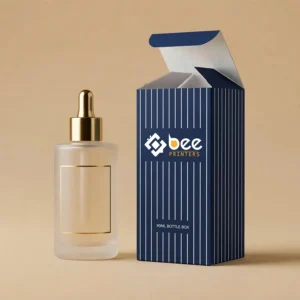 Open navy blue box with white vertical pinstripes and Bee Printers logo beside a frosted dropper bottle with a gold cap on a warm tan background, showing custom 90ml bottle boxes