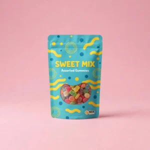 A sealed turquoise stand-up pouch with yellow wavy patterns and blue dots labelled Sweet Mix Assorted Gummies with a clear window showing colourful gummy candies and a small Bee Printers logo at the bottom right on a solid pink background, showing custom candy bag packaging