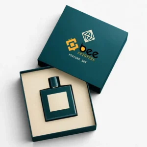 A dark teal perfume box open with a cream insert holding a dark teal perfume bottle with a blank cream label and its lid resting behind on a white background, showing custom luxury perfume boxes