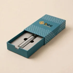 A teal drawer-style vape box with a white grid pattern partly open to reveal a silver vape pen in a grey insert on a beige background, showing custom luxury vape boxes