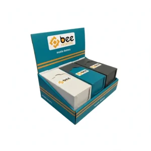 Open teal counter display box with orange stripes holding three small white, teal and black inner boxes on a white background, showing custom mobile battery packaging