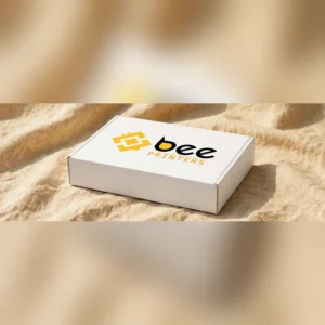 Custom rigid boxes with insert shown closed at a three-quarter angle on a linen backdrop, Bee Printers logo printed on the lid
