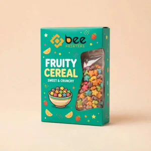 Teal generic fruity cereal box with the Bee Printers logo at the top, colourful fruit icons, a bowl of star-shaped cereal illustration and a large side window showing multicoloured star cereal pieces on a beige background, showing fruity pebbles cereal boxes