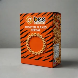 Orange cereal box with black stripe pattern on a grey background with FROSTED FLAKES CEREAL lettering, a circle of oat rings on the front and cereal pieces down the side panel with the Bee Printers logo at the top, showing tiger cereal box
